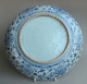 A Chinese dish from the mid Ming Hongzhi period vigorously decorated wth peony scrolls and ornamental rockwork