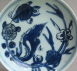 A late Ming dish with water plants and flowers, Tianqi or Chongzhen